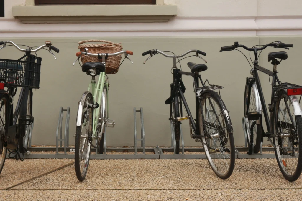 Bikes parked in outdoor bike racks on sidewalk